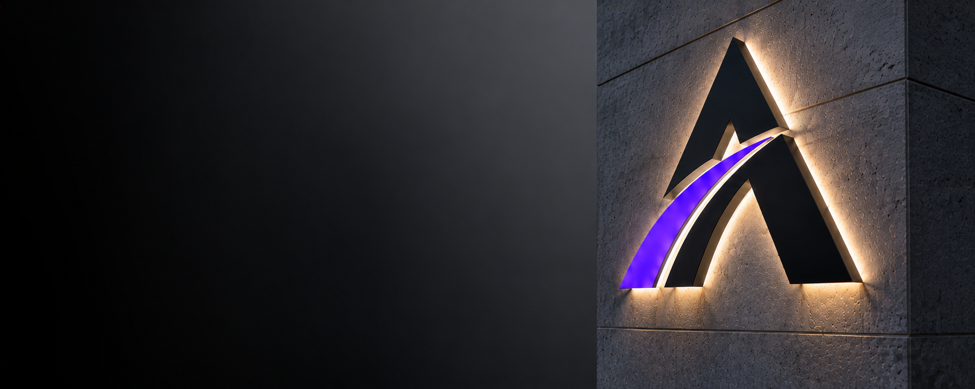 Illuminated Automotionary emblem mounted on a wall